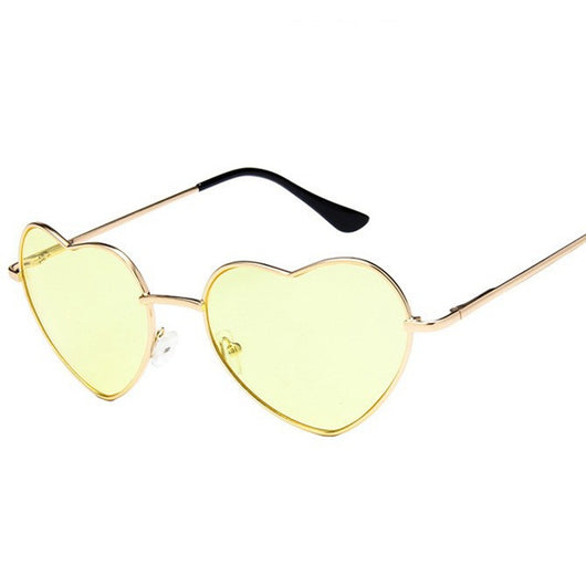 Gold frame heart-shaped sunglasses with transparent yellow lenses and black earpiece tips. - Image 3