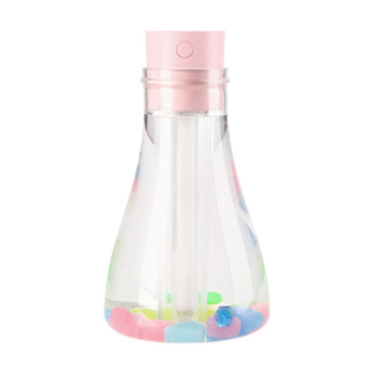 Wishing bottle humidifier with a clear body, white top, and colorful decorative stones at the bottom. - Image 6