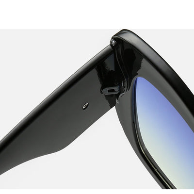 Leopard print cat-eye sunglasses with a red frame, gradient brown lenses, and a red heart embellishment. - Image 2