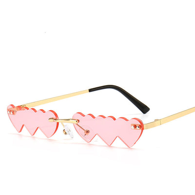 Women's rimless sunglasses with unique heart-shaped black lenses and gold-colored metal temples. - Image 8