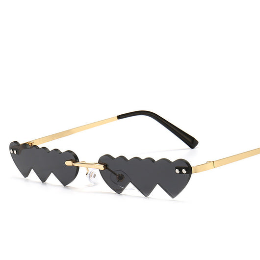 Women's rimless sunglasses with unique heart-shaped black lenses and gold-colored metal temples. - Image 9