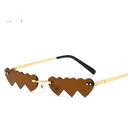 Women's rimless sunglasses with unique heart-shaped black lenses and gold-colored metal temples. - Image 5