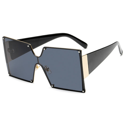 Oversized rimless square sunglasses with gradient brown lenses, black temples, and gold-tone accents.