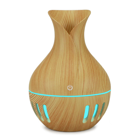 Dark brown wood grain mini USB humidifier with a vase-like shape and a green LED light band and slots. - Image 4