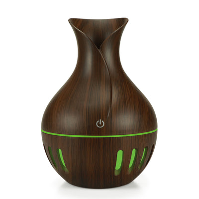Dark brown wood grain mini USB humidifier with a vase-like shape and a green LED light band and slots. - Image 5