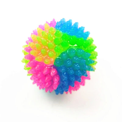 High stretch dog toy ball with a luminous tricolor design, featuring vibrant rainbow colors and a textured surface. - Image 10
