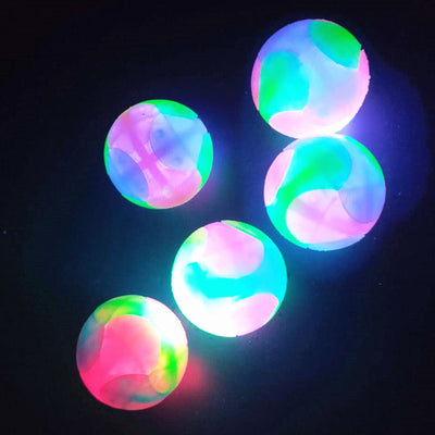 High stretch dog toy ball with a luminous tricolor design, featuring vibrant rainbow colors and a textured surface. - Image 2