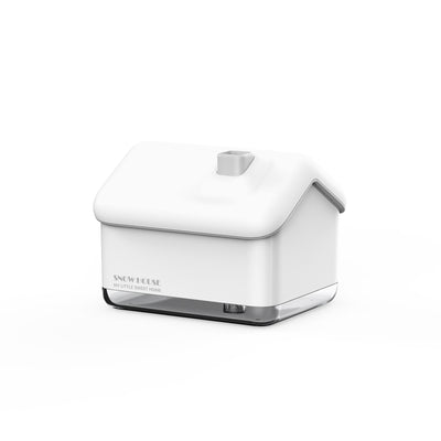 Pink and white house-shaped humidifier and essential oil diffuser with a clear base and a white power cord. - Image 14
