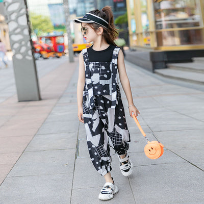 Girls' two-piece outfit with a black sleeveless top and black and white camouflage wide-leg suspender pants. - Image 9