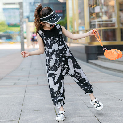 Girls' two-piece outfit with a black sleeveless top and black and white camouflage wide-leg suspender pants. - Image 10