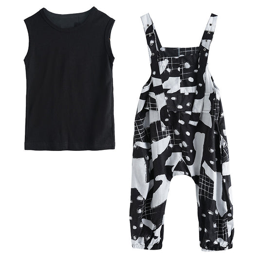 Girls' two-piece outfit with a black sleeveless top and black and white camouflage wide-leg suspender pants. - Image 7