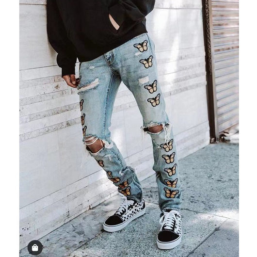 Jeans Slim Fit con Bordado de Mariposas y Detalles Desgastados