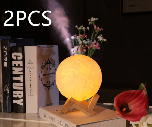 Moon-shaped night light and air humidifier on a wooden stand, emitting mist and a warm glow, with books and flowers. - Image 10