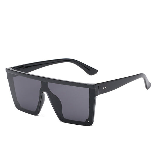 Oversized flat-top sunglasses with a brown tortoise shell frame and brown gradient lenses.