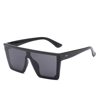 Oversized flat-top sunglasses with a brown tortoise shell frame and brown gradient lenses.
