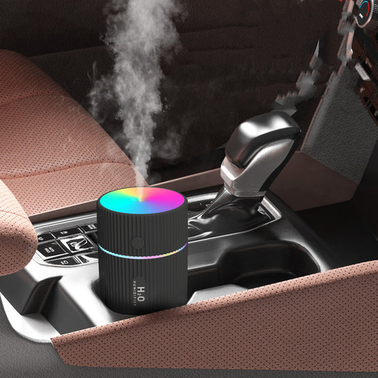 White cylindrical humidifier with ribbed texture, colorful LED lights, and a power button, ideal for home, office, or car. - Image 7