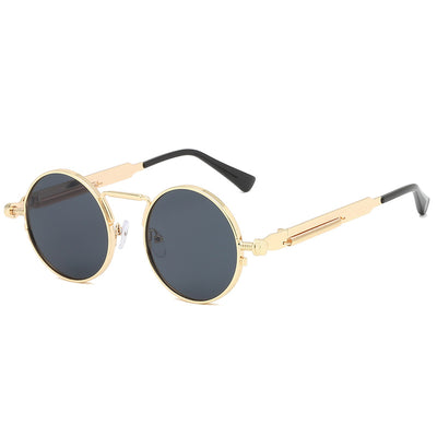 Round red lens sunglasses with a black metal frame and unique spring-leg temples on a white background. - Image 2