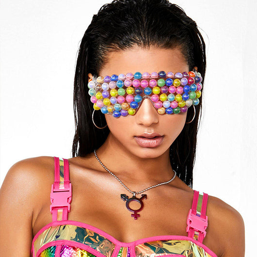 Clear shield sunglasses with multiple rows of colorful, iridescent round beads covering the front, on a white background. - Image 9
