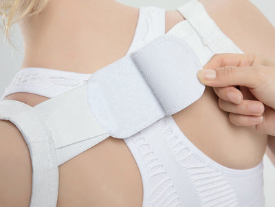 White posture correction belt with adjustable shoulder straps and a central rectangular pad for back support. - Image 14