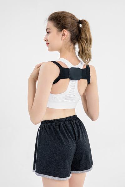 White posture correction belt with adjustable shoulder straps and a central rectangular pad for back support. - Image 16