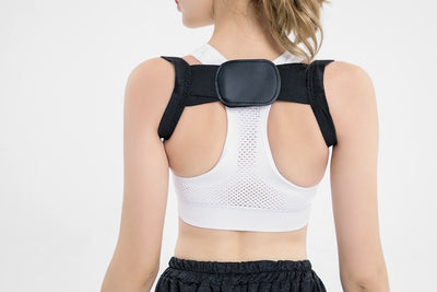 White posture correction belt with adjustable shoulder straps and a central rectangular pad for back support. - Image 19