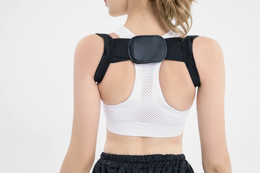 White posture correction belt with adjustable shoulder straps and a central rectangular pad for back support. - Image 19