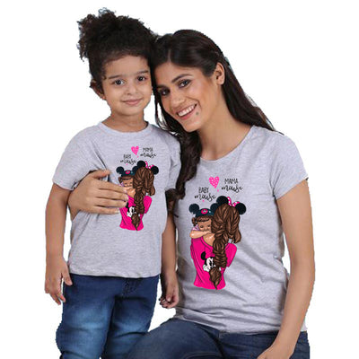 Mother and daughter wearing matching gray short-sleeved t-shirts with a cartoon graphic of a mother holding a child, both wearing Minnie Mouse ears, and text "B - Image 11