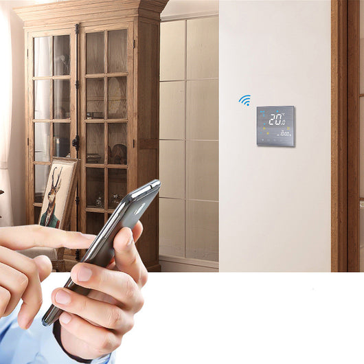 Wall mounted digital furnace temperature controller with a brushed silver finish, displaying 20.0°C and 10:00 AM. - Image 4