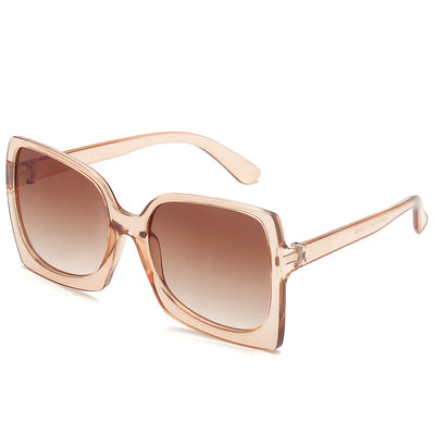 Oversized square-frame sunglasses with translucent peach frames and brown gradient lenses on a white background. - Image 10