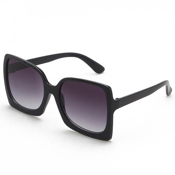 Oversized square-frame sunglasses with translucent peach frames and brown gradient lenses on a white background. - Image 4
