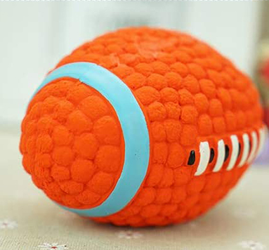 Orange textured latex dog toy shaped like an American football with blue and white accents, measuring 14cm long and 8cm wide. - Image 4