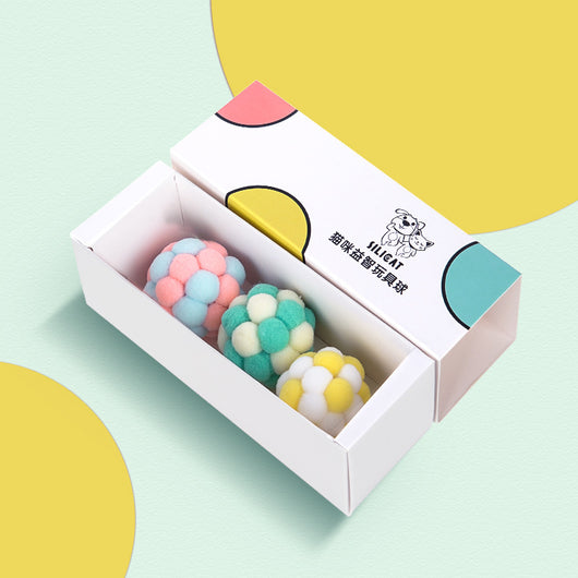 Three plush elastic bell balls for cats in a white gift box. Balls are pink/green, blue/white, and brown/white. - Image 3