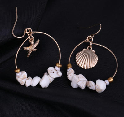 Aretes Estrella de Cinco Puntas en Metal Salvaje con Concha Marina - Image 9