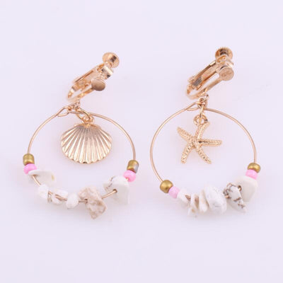 Aretes Estrella de Cinco Puntas en Metal Salvaje con Concha Marina - Image 10
