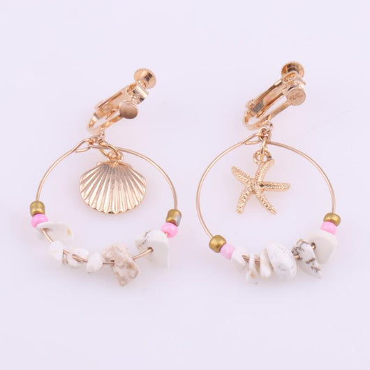 Aretes Estrella de Cinco Puntas en Metal Salvaje con Concha Marina - Image 10