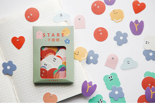 Six boxes of assorted stickers, including themes like geometry, fruits, planets, and cute characters, displayed on a white surface. - Image 14