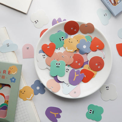 Six boxes of assorted stickers, including themes like geometry, fruits, planets, and cute characters, displayed on a white surface. - Image 8