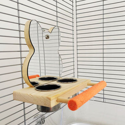 Parrot puzzle bird toy with a wooden stand, mirror, two stainless steel food cups, and an orange perching bar. - Image 3