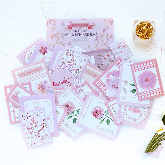 Stamp Impression Sticker Pack with various paper stickers featuring illustrations, text, and patterns, some with scalloped edges.