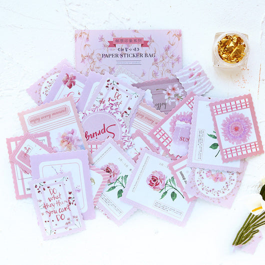 Stamp Impression Sticker Pack with various paper stickers featuring illustrations, text, and patterns, some with scalloped edges.