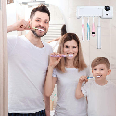 White toothbrush disinfector with UV light, USB cable, alcohol prep pad, and mounting strips on a light blue background. - Image 11
