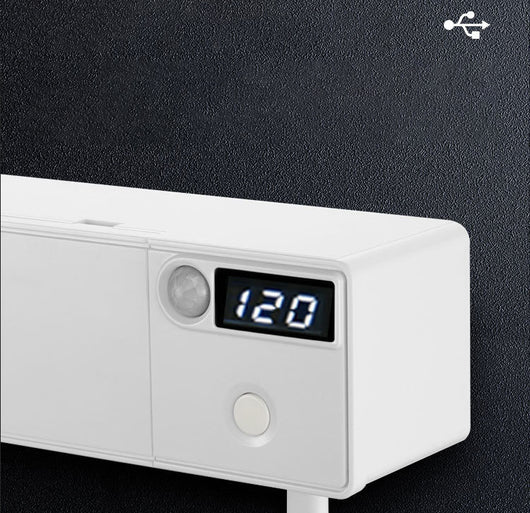 White toothbrush disinfector with UV light, USB cable, alcohol prep pad, and mounting strips on a light blue background. - Image 5