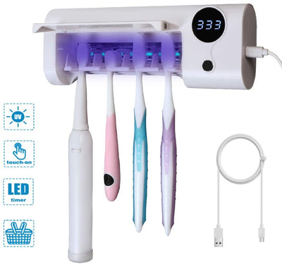 White toothbrush disinfector with UV light, USB cable, alcohol prep pad, and mounting strips on a light blue background. - Image 8