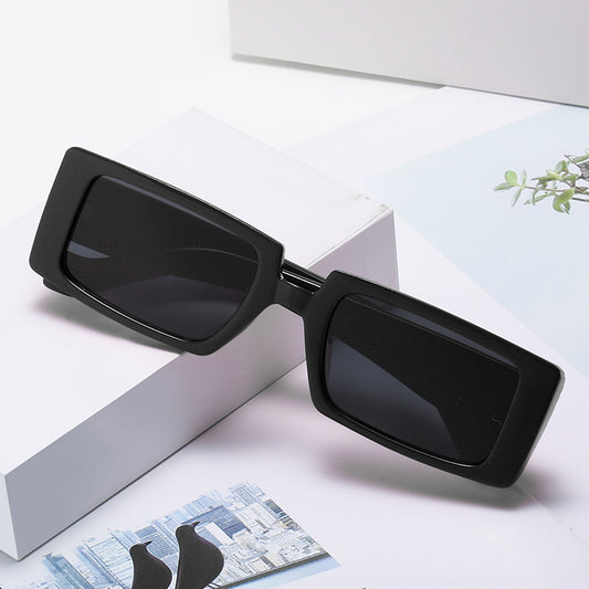 Neon green square sunglasses with light gray lenses, featuring a bold and trendy rectangular frame.