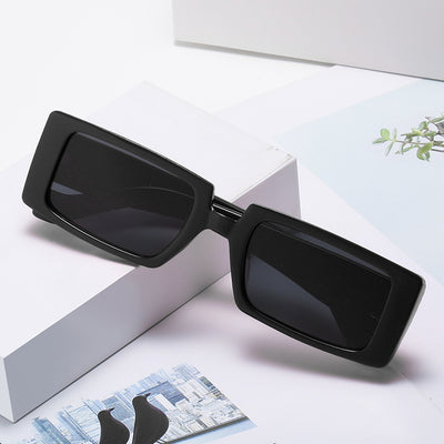 Neon green square sunglasses with light gray lenses, featuring a bold and trendy rectangular frame.