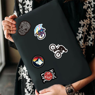 A collection of 50 self-adhesive stickers featuring various mountain biking and cycling designs and slogans. - Image 12