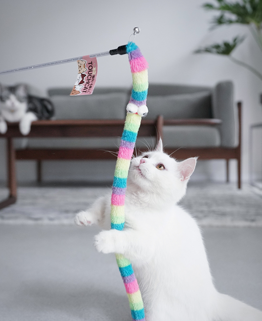 Cat wand toy with a flexible, purple and white spotted worm-like attachment and a small bell. - Image 5