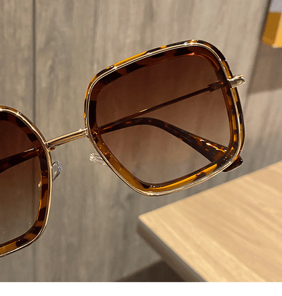 Retro big frame square brown sunglasses for women with white outer frames and gold-toned inner rims. - Image 4