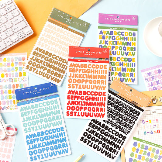 Six sheets of self-adhesive letter, number, and symbol stickers in blue and purple 'Star River Palette' designs.