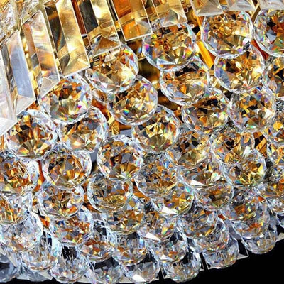 Clear faceted crystal ball bead, possibly K9 crystal, with a hole for stringing, against a dark background. - Image 5